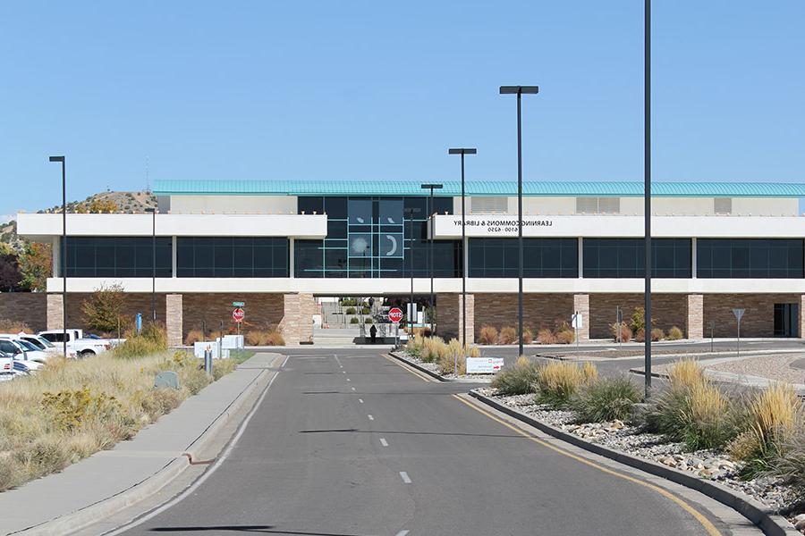 View of the Learning Commons Building with the San Juan College logo on the library windows.