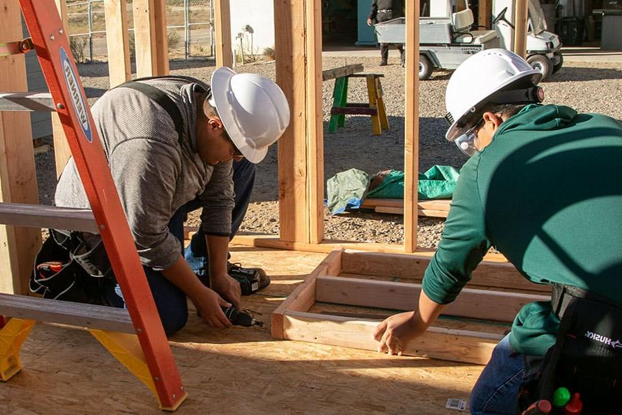 Students framing in the Building Trades Certification Program at SJC